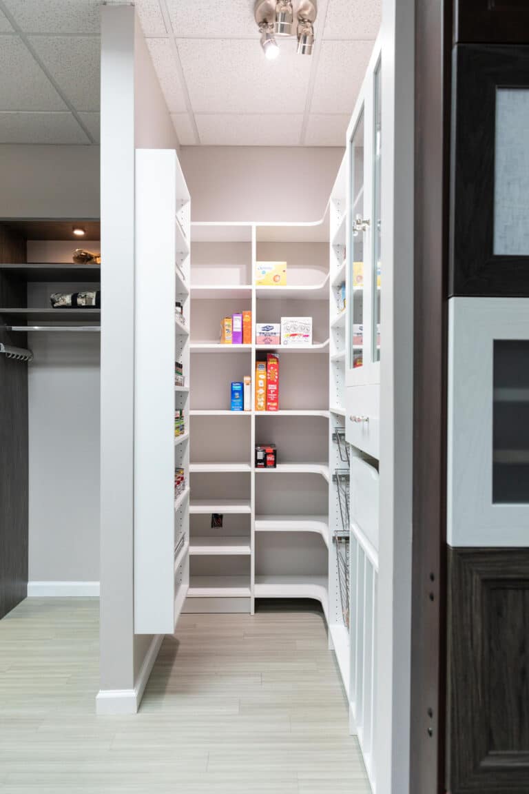 Various food and beverage boxes neatly stored in a custom kitchen pantry