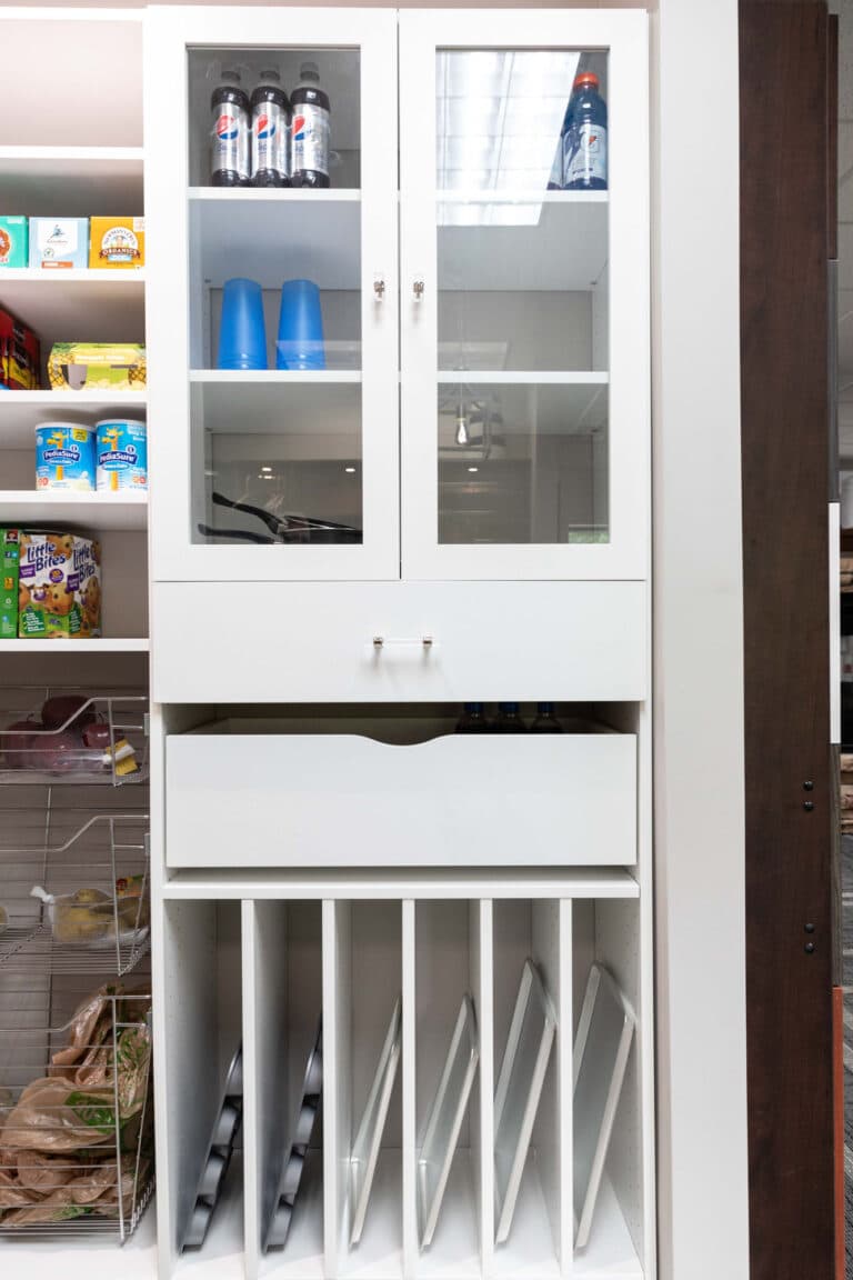 A kitchen pantry custom storage design with drawers and door closed