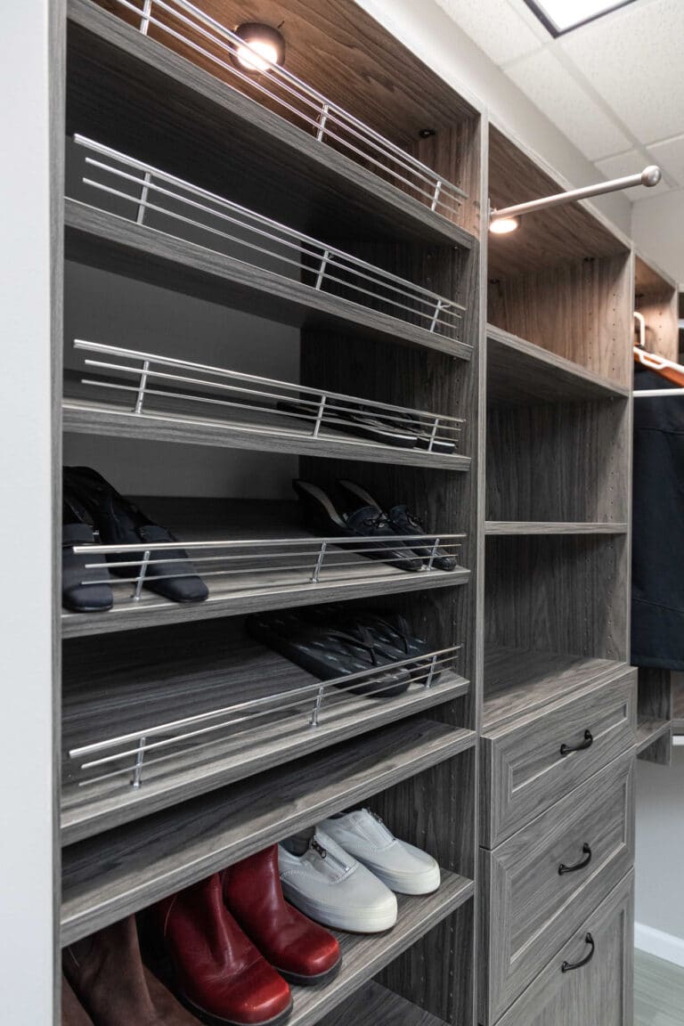 a custom designed closet installation with custom shoe racks