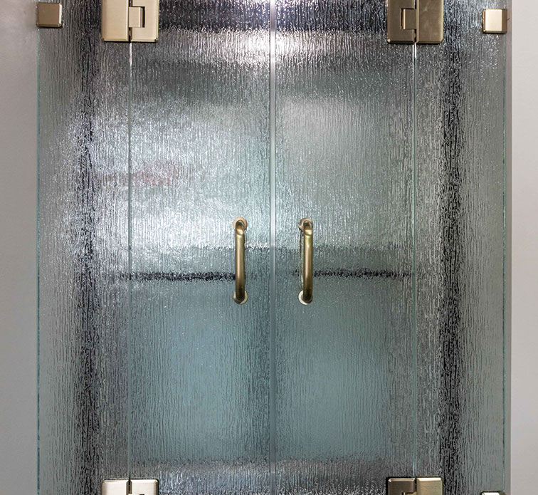 A set of frameless glass double shower doors