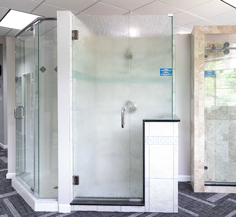 A frameless heavy glass door with return enclosure