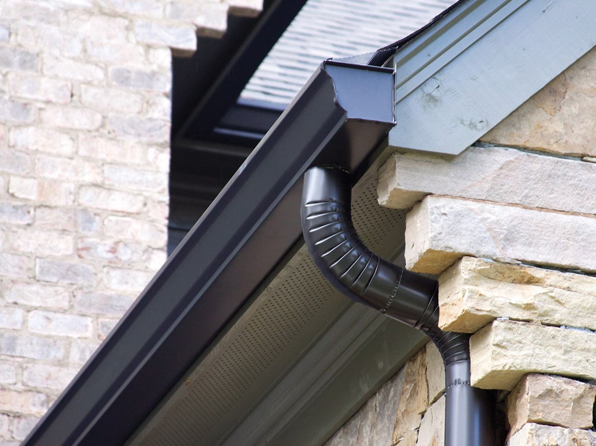 A k-style gutter with a round downpipe