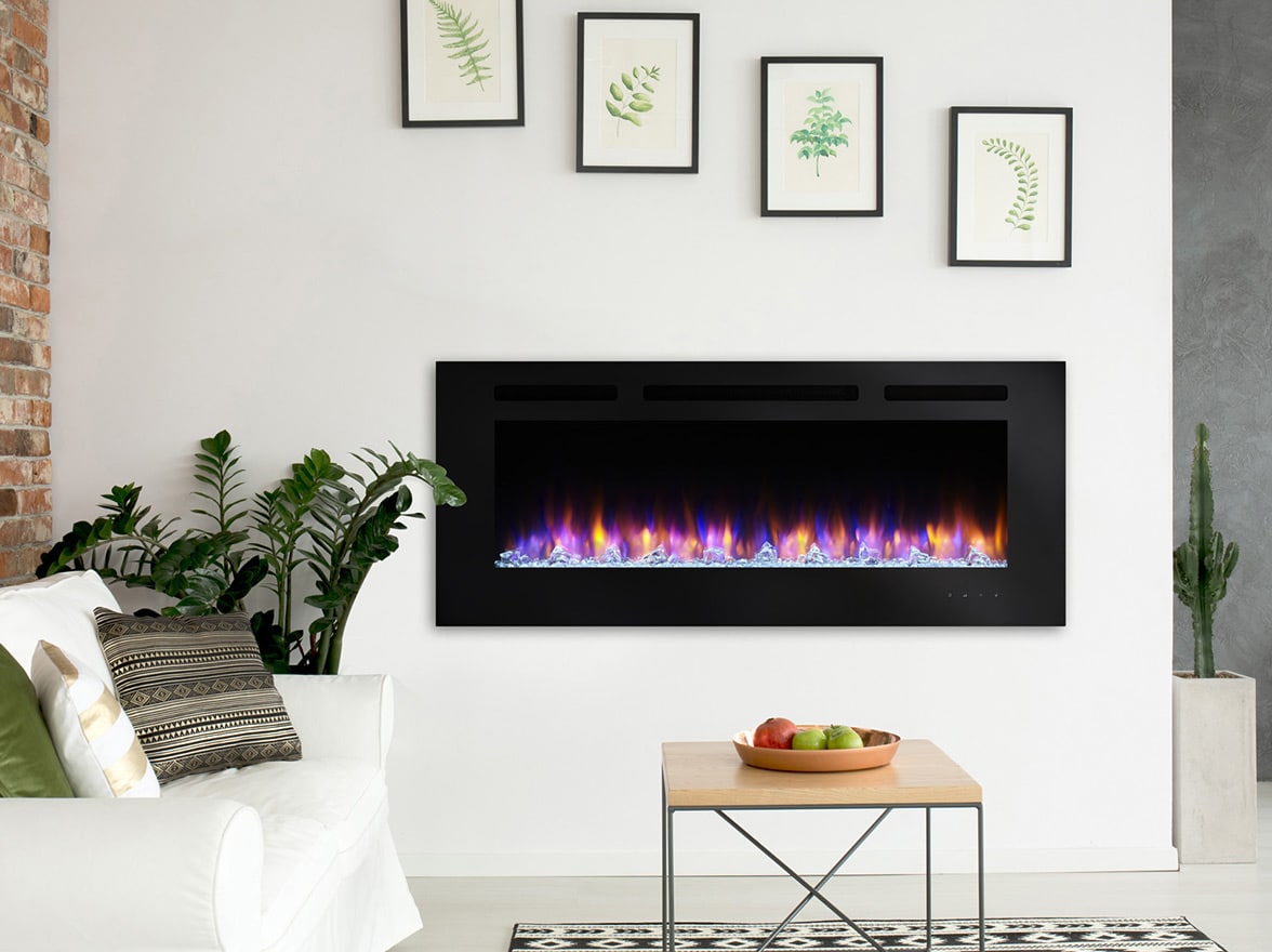 An electric fireplace in a modern room with a white sofa and table