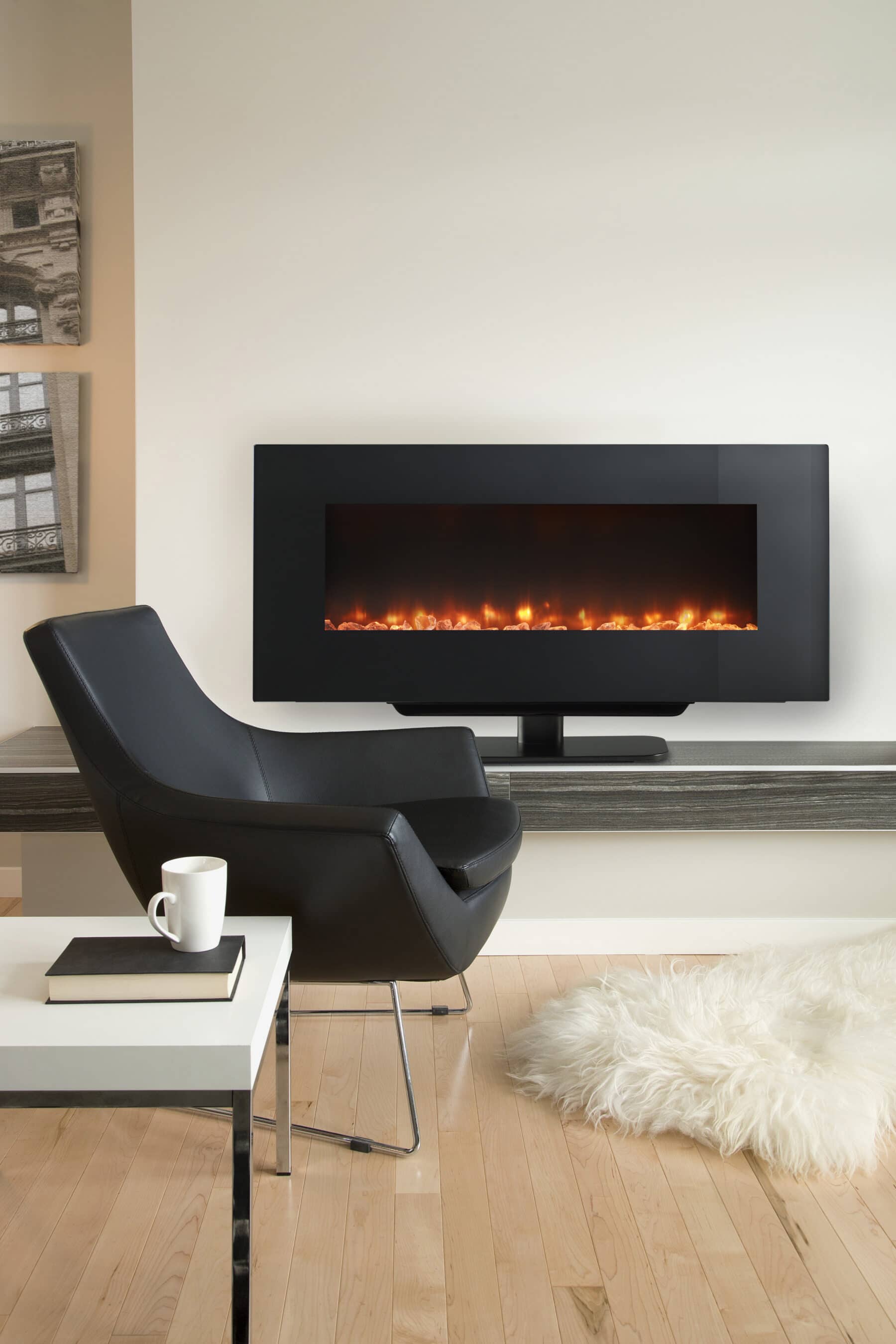 An electric fireplace in a modern room with a black leather chair