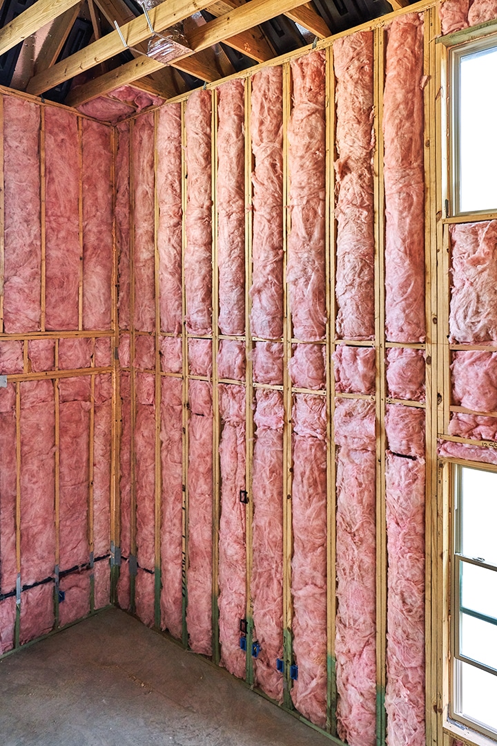 Unfaced wall batt insulation installed in a basement